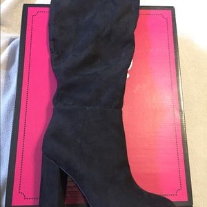 A brand new pair of Calla, black boots.